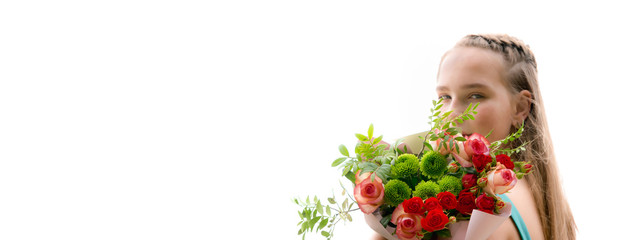 Banner. Teen girl holding a bouquet of flowers in her hands and smiling on a white background is isolated, the idea of a holiday