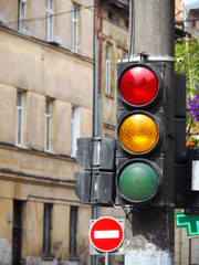 Red, yellow and green colors on the traffic light