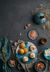  Profiteroles with cream cheese and shrimp on a gray background