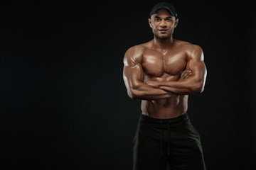 Fototapeta na wymiar Bodybuilding competitions on the scene. Man sportsmen bodybuilder physique and athlete. Fitness motivation.
