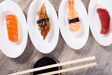 four kinds of Nigirisushi on oval saucers