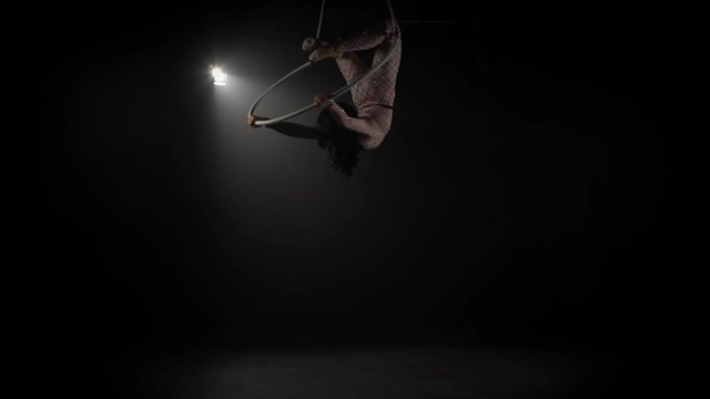Young girl performs the acrobatic elements in the air ring 007