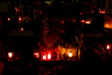 graveyard at night with candle light