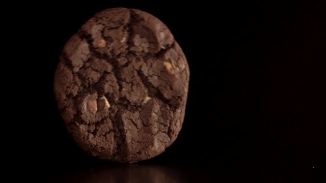 Chocolate cookie rolling across the screen. Catching the cookie and breaking it