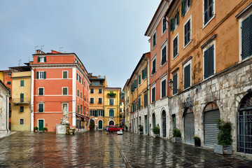 Fototapeta na wymiar City of Carrara in rainy september day. Tuscany, Italy