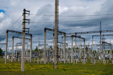 Electricity distribution station. Lots of wires, poles and shields.