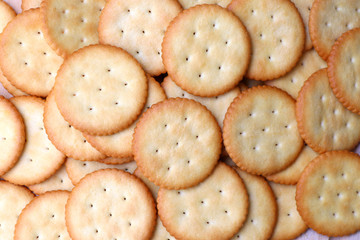 Biscuits cracker background. Crackers lay on the table.