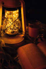 Warm light of lamp, book, blanket