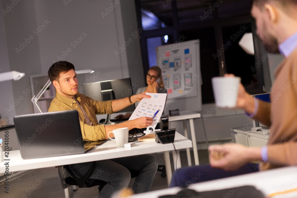 Poster business, deadline and technology concept - software developers discussing user interface design moc