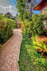 Tropical gardens around a swimming pool in Pattaya, Thailand