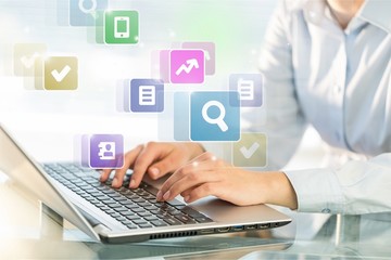 Woman Working with Laptop on blurred background, close-up