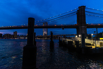 Brooklyn Bridge at night in Manhattan, New York City, USA