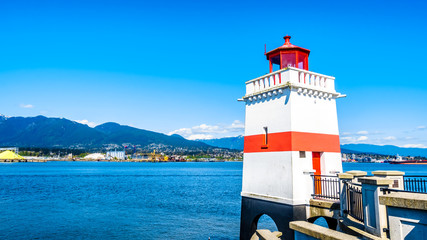 Fototapeta na wymiar Brockton Point with the famous lighthouse on the famous Seawall pathway in Vancouver's Stanley Park in British Columbia, Canada