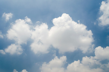 Cumulus clouds inthe bright blue sky