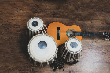 Acoustic guitar, cajon and tabla - view of the musical instruments used for fusion eastern and...