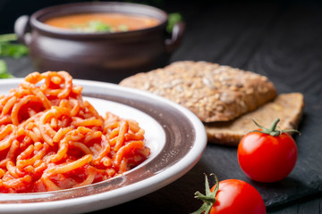 Vermicelli in tomato Sauce, bread, tomato soup, and two cherry tomatoes