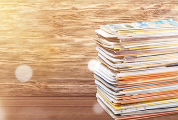 Pile of newspapers on white background
