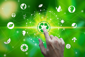 Finger touch with environment icons over the Network connection on nature background, Technology ecology concept