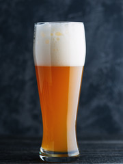 Glass of unfiltered wheat craft beer