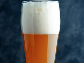 Wheat unfiltered beer in a glass close-up