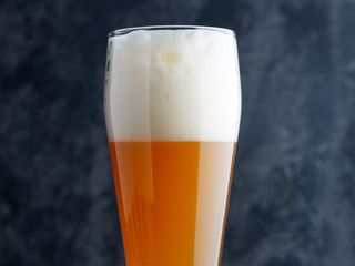 Glass of unfiltered wheat craft beer