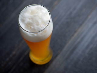 Wheat unfiltered beer in a glass close-up