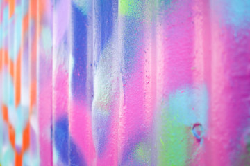 A closeup of color blend schemes on a metal sheet wall