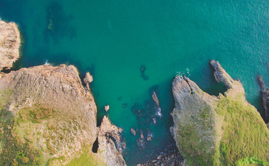 Top down view of rocky coastline with caves