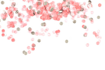 Delicate pink confetti isolated on white background.