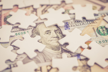 JIGSAW PUZZLE WITH DOLLAR