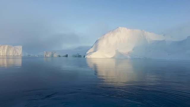 Massive Iceberg in Arctic Ocean in a foggy day
