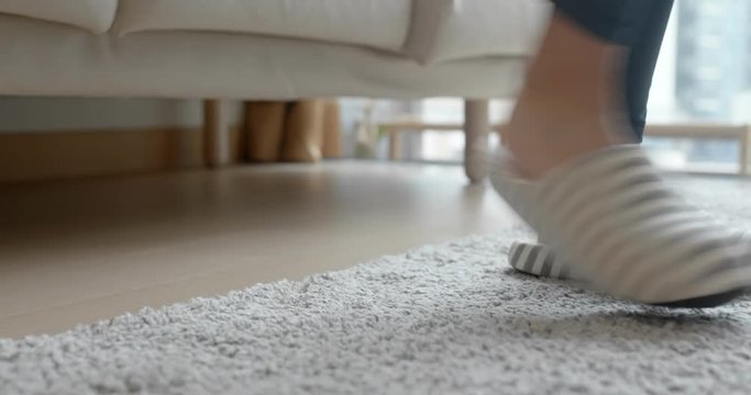 Woman wearing slipper at home