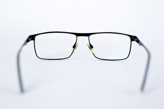 glasses for the visually impaired, poorly sighted.glasses with aspherical astigmatic lenses  in black frame on a white background.
