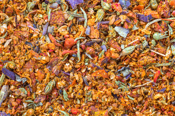 Abstract textured natural bright orange colorful copy space background. Millet, oak, different grains small particles, fish and parrot food.