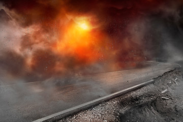 The road was destroyed and damaged with dust and smoke, concept of wars