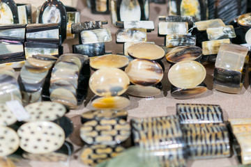 Women's bracelets from semiprecious stones. Bracelets on hand in the store. Women's bracelets from semiprecious stones. Showcase in the shop