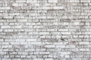 Old wall made of red brick, painted white in loft style for modern designer interior of room, bar or restaurant