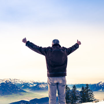 The man is happy with nature and life. Figure of a man with open  arms.