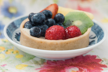Fruit tart with soft focus background