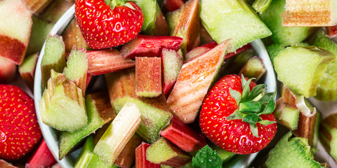 Close up of Pieces of Raw and Freshly Cut Rhubarb and Strawberries, Background Image