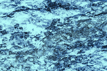 Vintage blue background. Rough painted wall of sapphire color. Imperfect plane of blue colored. Uneven old decorative toned backdrop of cyan tint. Texture of sapphirine hue. Ornamental stony surface.