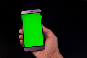 hand holding smart phone with blank screen isolated on white