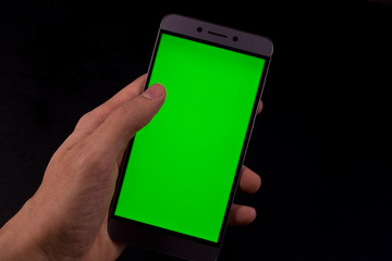 hand holding smart phone with blank screen isolated on white