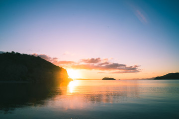  	 Beautiful sunset with reflections in the water in the californian coast.