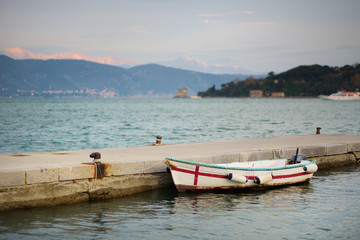 Lonely fishing boat in marina of Porto Venere town, a part of the Italian Riviera, Italy.