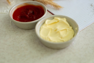 We cook a great breakfast. In the photo: sauces, flour, olive oil, wheat, butter, cheese, bread and a notebook.
