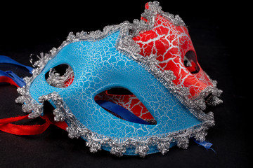 masquerade masks red and blue on a black background