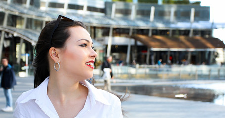 Woman walking in a modern city