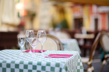 Beautifully decorated small outdoor restaurant tables in the city of Lerici, Italy