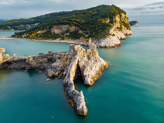 Aerial view of the Gothic-style Church of St. Peter sitting atop a rocky headland in Porto Venere...